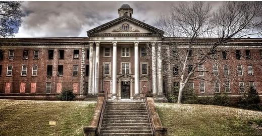 An image of the abandoned Central State Hospital in Milledgeville, GA.
